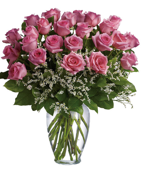 One dozen long stemmed pink roses in a clear glass vase.