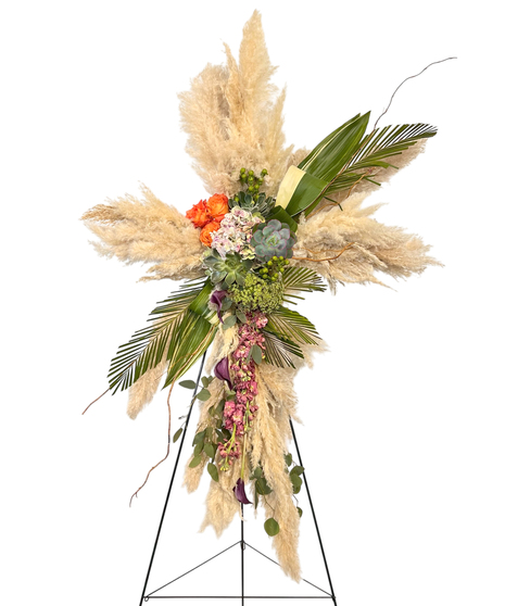 Sympathy wreath of pastel pink, peach and purple flowers