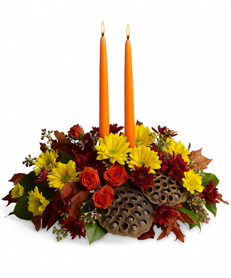 Fall centerpiece with taper candles. 